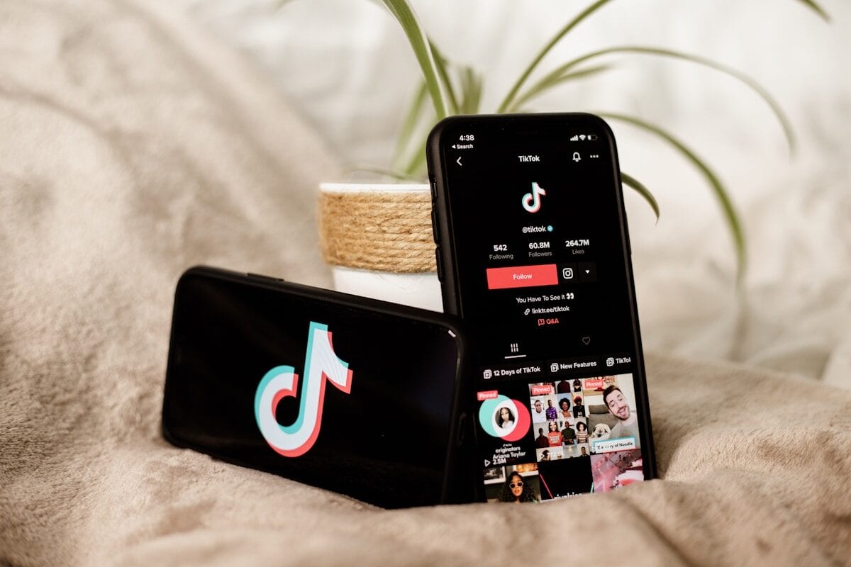 TikTok a couple of cell phones sitting on top of a bed